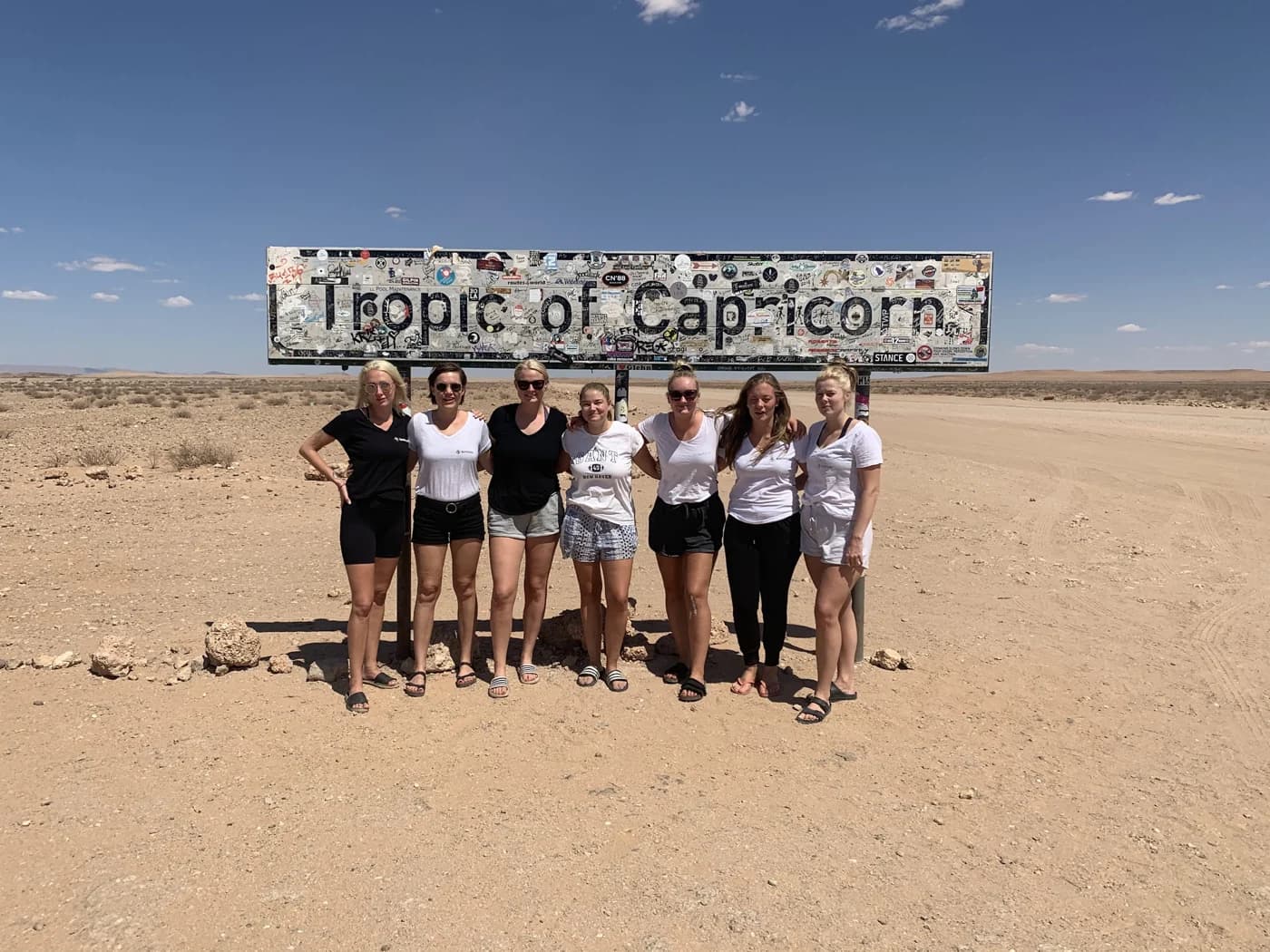 Students at the Tropic of Capricorn sign