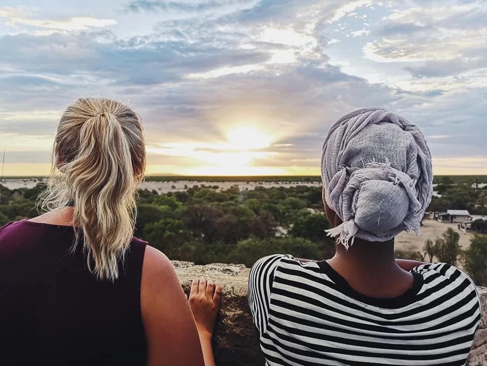 Two students enjoying a Namibian sunset together