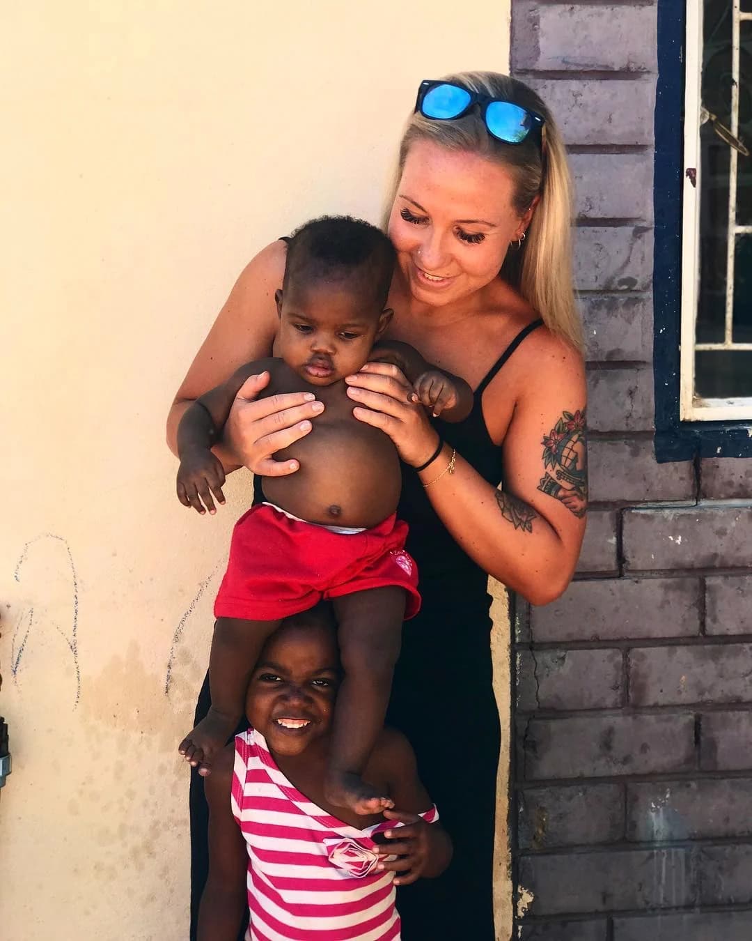 A volunteer connecting with children at a local placement